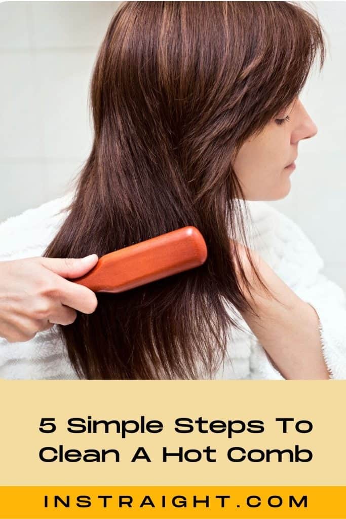 woman brushing her hair using a hot comb
